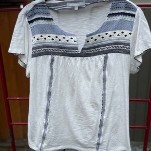 White and blue cotton blouse.